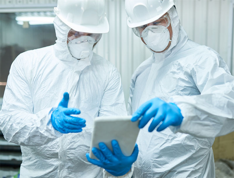 Two scientists in protective lab wear