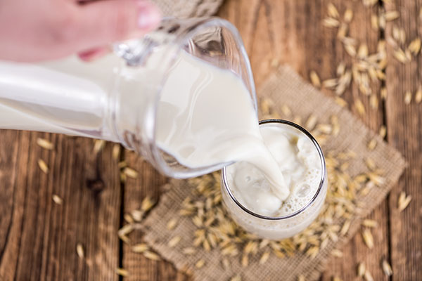 Pouring fresh milk into a glass