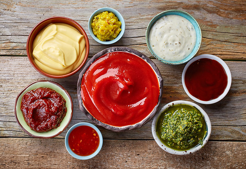 A variety of different sauces in bowls