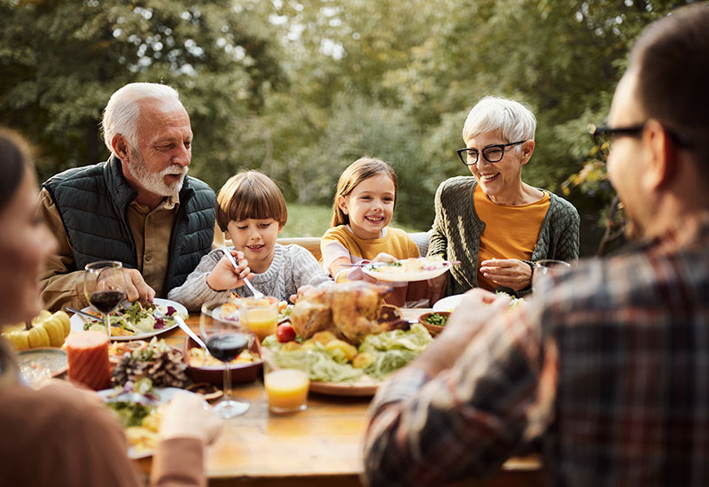 A family enjoying a meal outside