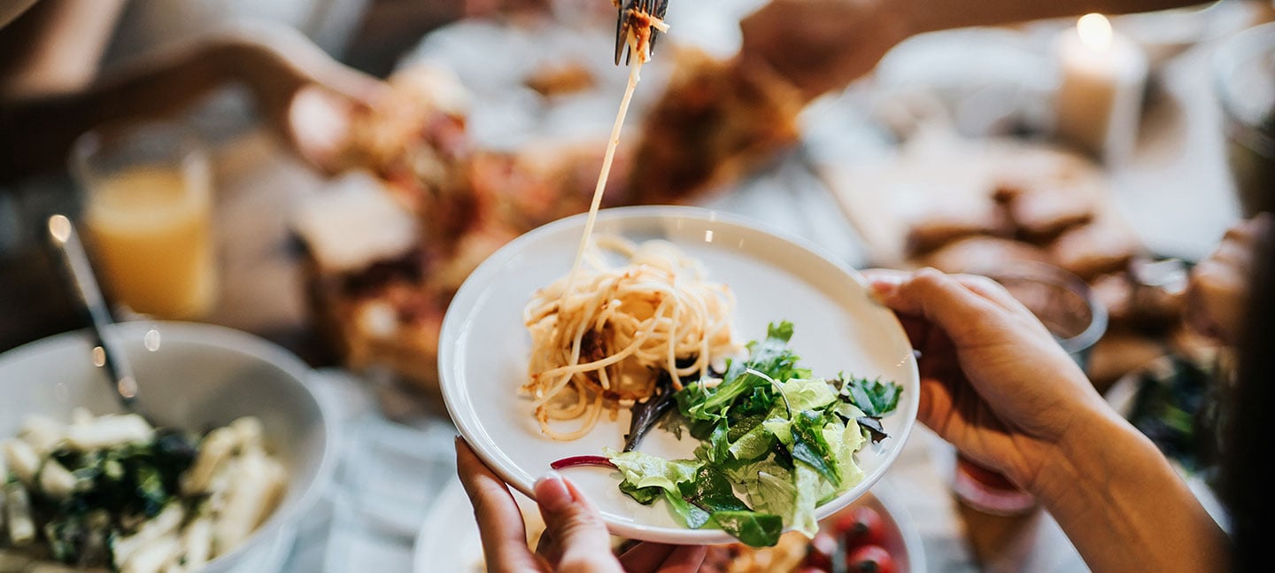 A plate of spaghetti and salad