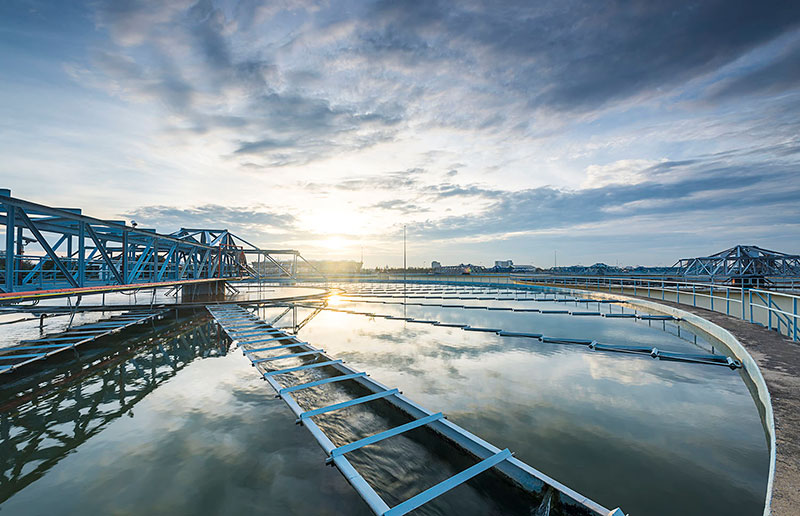 Sun setting over a water treatment plant