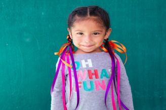 smiling child with braids