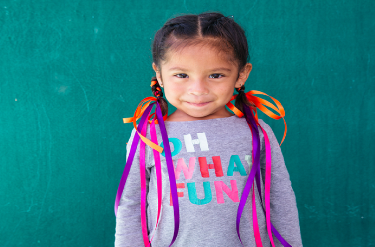 smiling child with braids