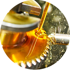 An amber colored lubricant is applied to metal gears