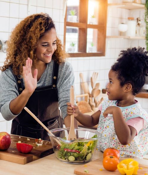 mother-daughter-making-veggie-meal