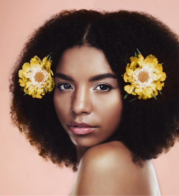 Fashionable woman with flowers in her hair